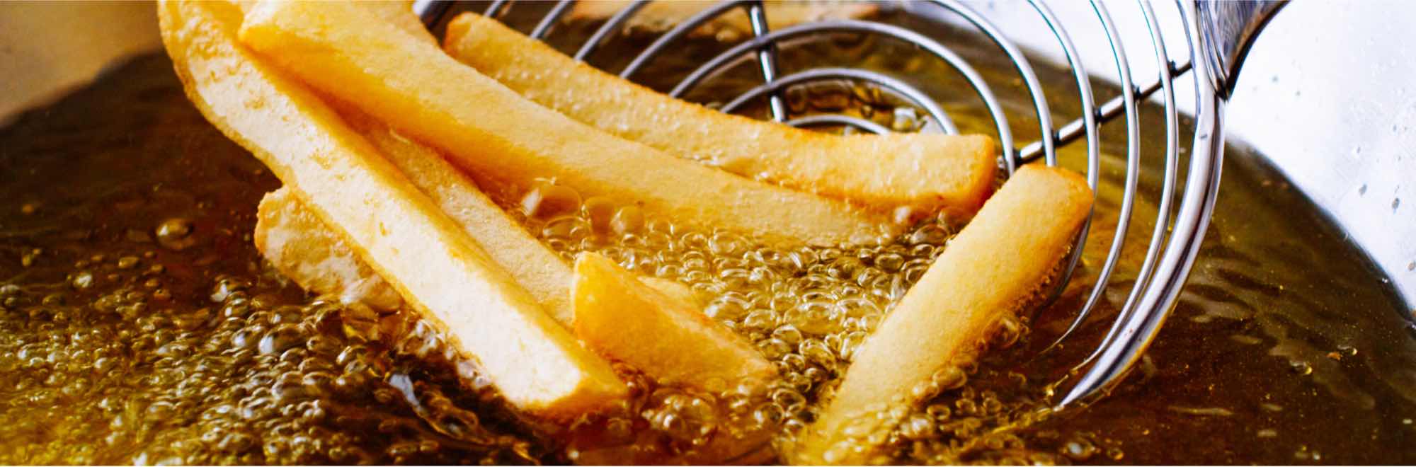 Photo shows potato chips being fried in oil